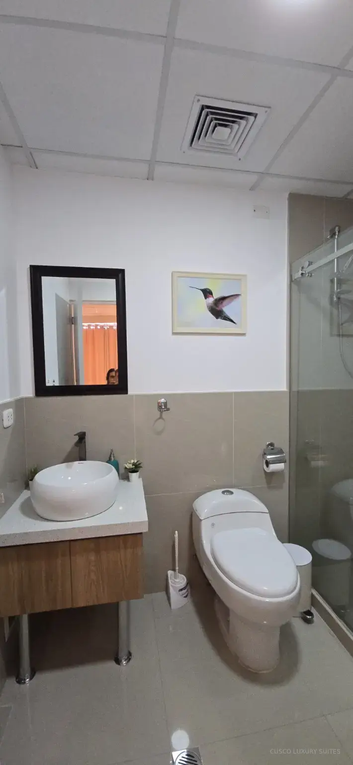 Fully equipped AYLLU SUITE kitchen with cookware, dishes and appliances