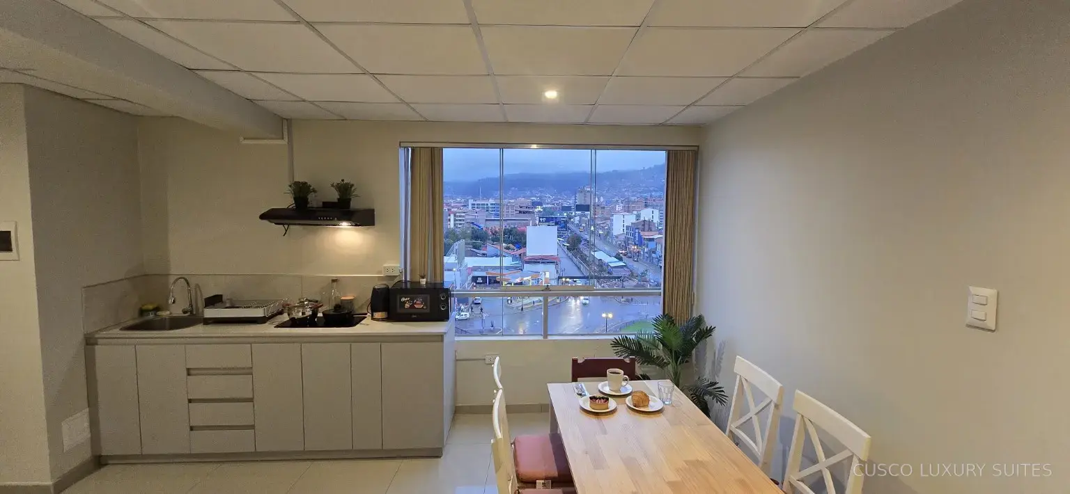 Open kitchen and dining area in AYLLU SUITE