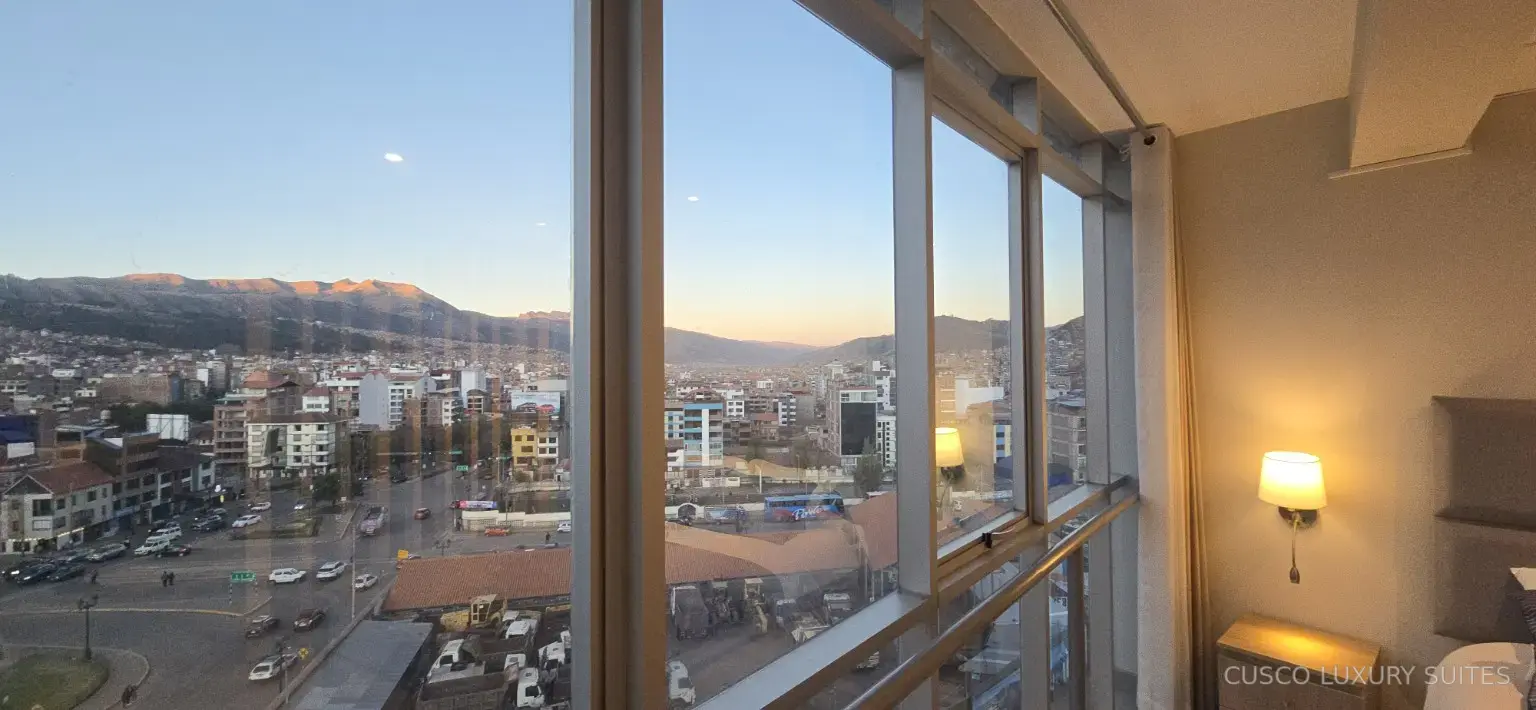 Twilight city and mountain view beside the INTI SUITE queen bedroom